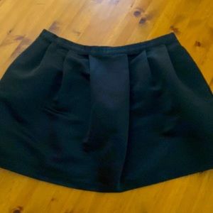 Black satin A line skirt with pockets.